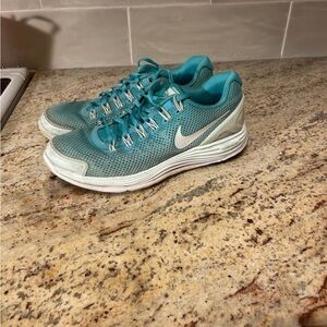 Nike Women’s Teal and White Athletic Running Shoes